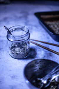Close-up of glass of jar on table