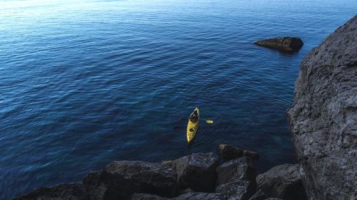 High angle view of rock formation in sea