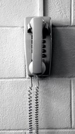 Close-up of telephone on wall