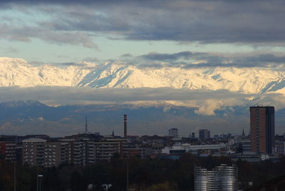 Buildings in city against sky