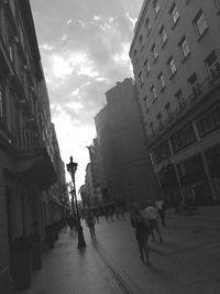 People walking on street in city