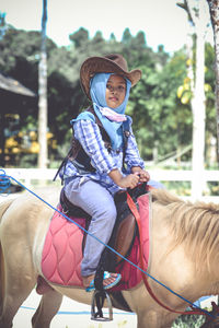 Full length of a man riding horse