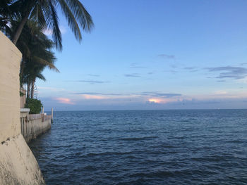 Scenic view of sea against sky at sunset