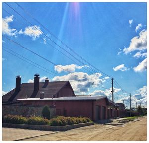 Buildings against blue sky and clouds