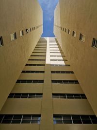 Low angle view of buildings against sky in city