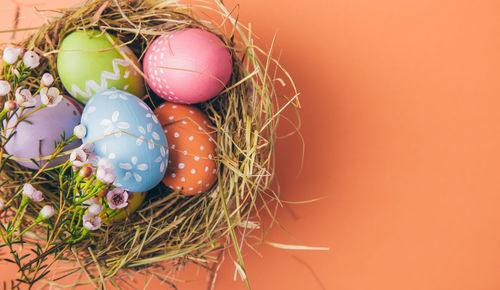 Close-up of multi colored eggs in nest