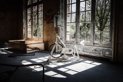 Rusty exercise bike in abandoned building