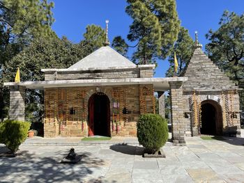 Entrance of historic building against clear sky