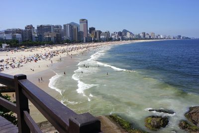 View of beach with city in background