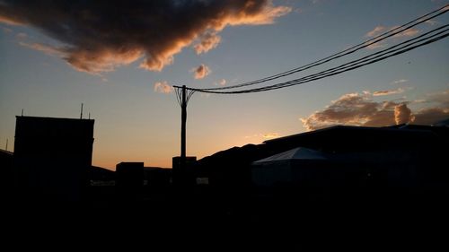 Low angle view of silhouette trees against sky at sunset