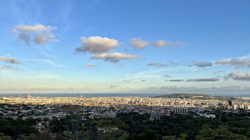 Aerial view of townscape against sky during sunset