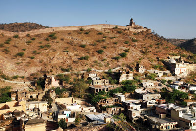 High angle view of residential district by mountain and amer fort