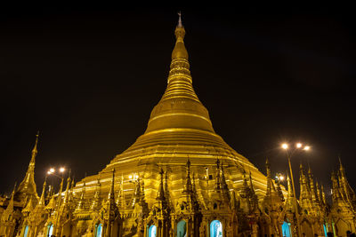 Low angle view of pagoda against sky at night