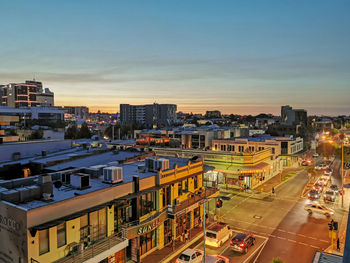 High angle view of buildings against sky during sunset