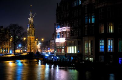 Reflection of buildings in city at night