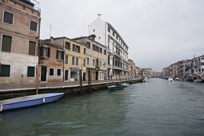 Canal passing through city buildings