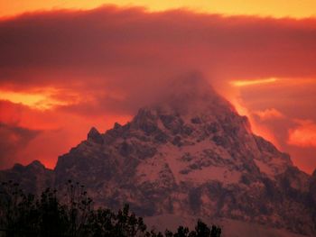 Low angle view of dramatic sky over mountain