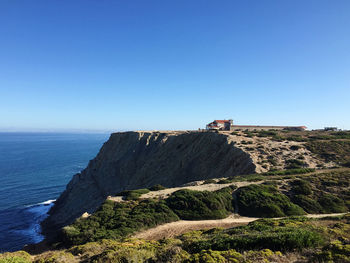 Scenic view of sea against clear blue sky