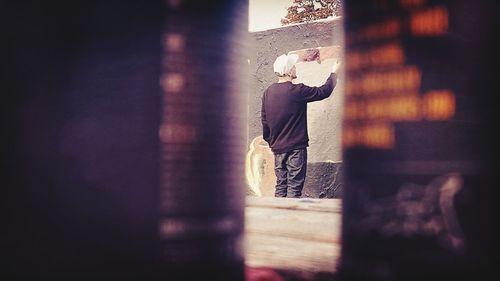 Man standing by window