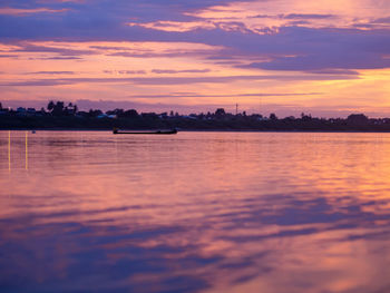 Scenic view of sea against orange sky