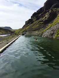 Scenic view of sea against cloudy sky