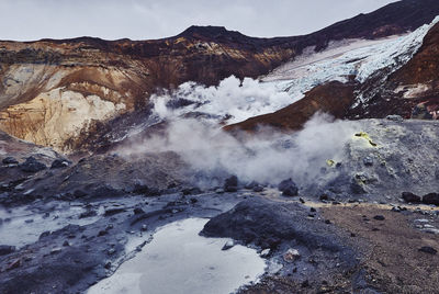 Smoke emitting from volcanic mountain