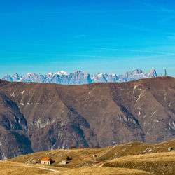 Scenic view of landscape against blue sky