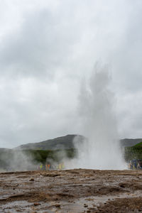 Scenic view of geysir against sky