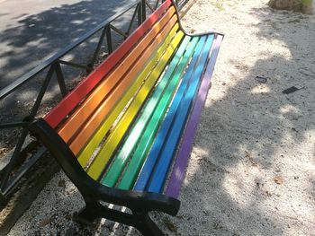 High angle view of empty bench on field