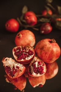 High angle view of fruits on table against black background