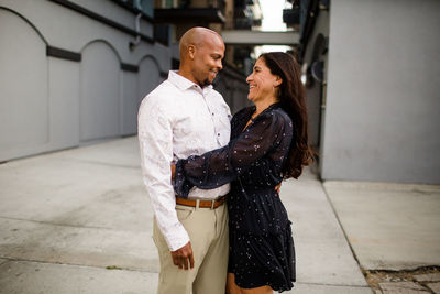 Side view of couple standing outdoors