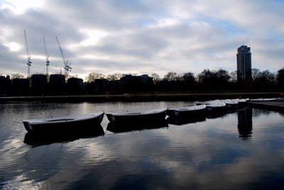Scenic view of river against cloudy sky