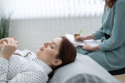 Patient lying down during therapy session