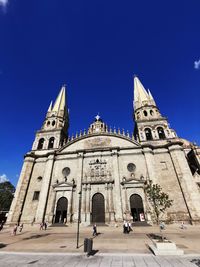 Low angle view of cathedral against blue sky