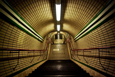 High angle view of illuminated subway staircase
