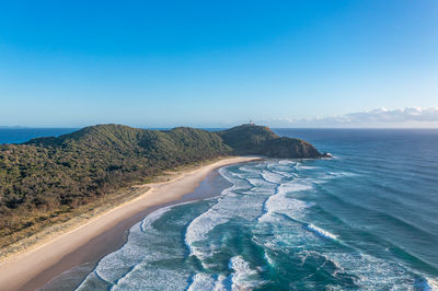 Byron bay australia. scenic view ocean beach patterned waves with white foam. travel and recreation
