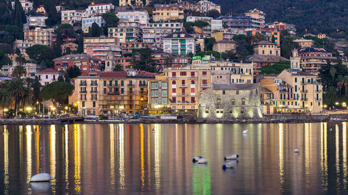 Illuminated sea by rapallo at dusk