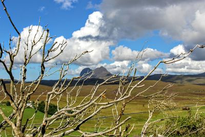 Scenic shot of mountain range against cloudy sky