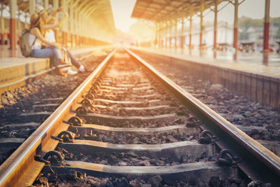 Sunlight falling on railroad track at platform