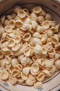 High angle view of candies in bowl on table