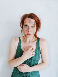 Portrait of a beautiful young woman over white background