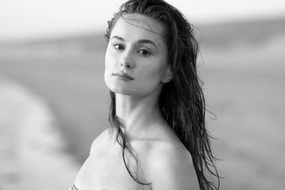 Close-up portrait of young woman at beach