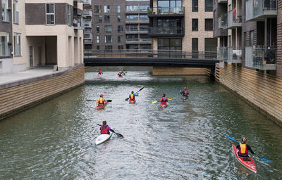 High angle view of people on boat in canal