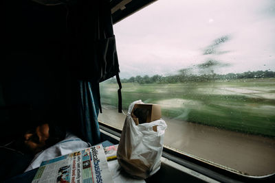 Train by window against sky