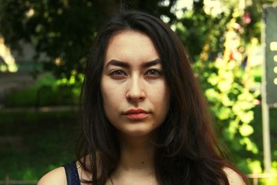 Close-up portrait of woman with brown eyes