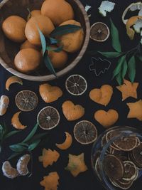 High angle view of fruits and leaves on table