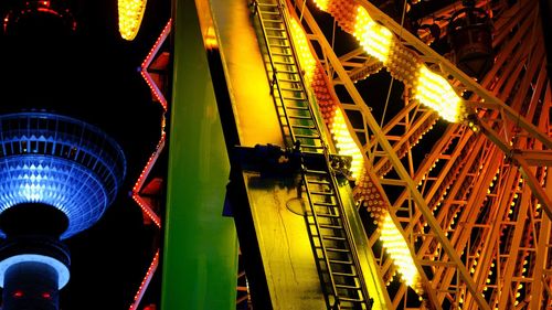 Low angle view of illuminated buildings at night