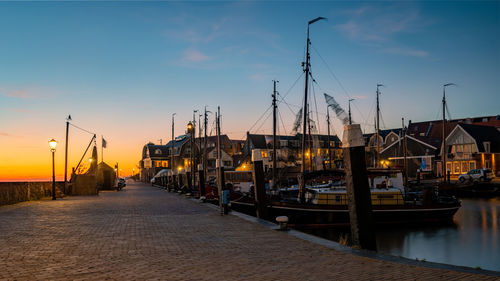 Boats moored at harbor