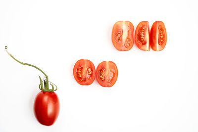 Close-up of red bell against white background