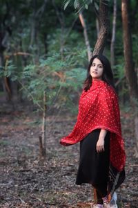 Portrait of young woman standing outdoors